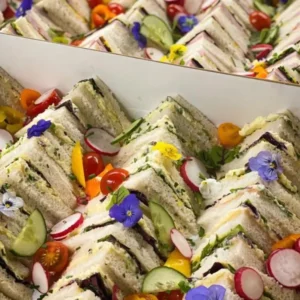 Gourmet sandwich platter with garnishes