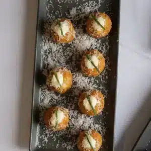 Arancini balls on grey platter