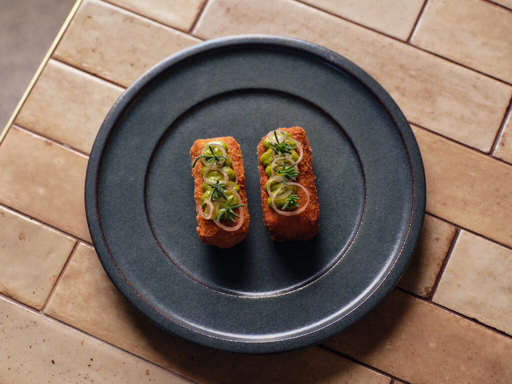 Fried potato croquettes with garnish