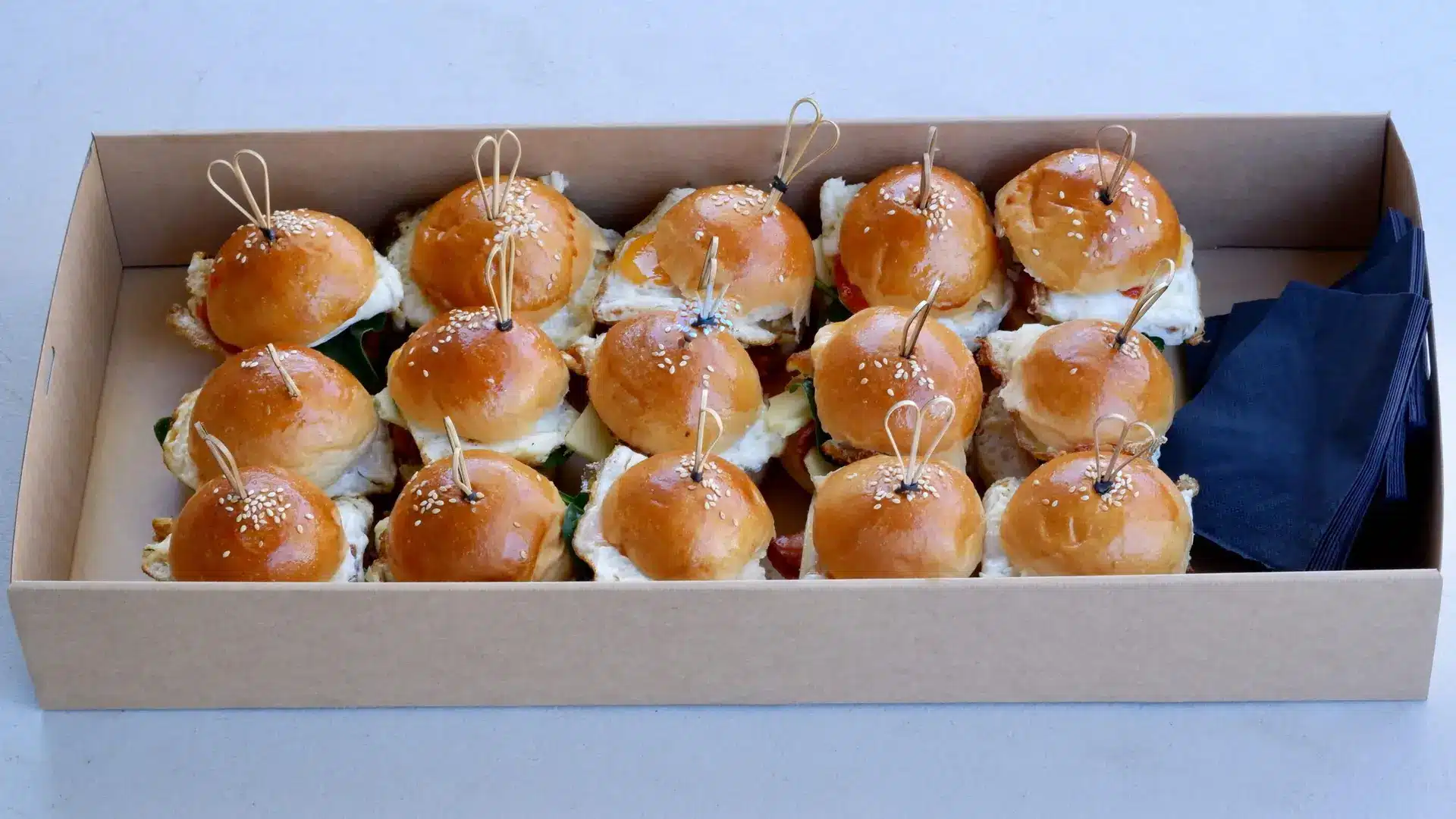 Box of mini slider sandwiches